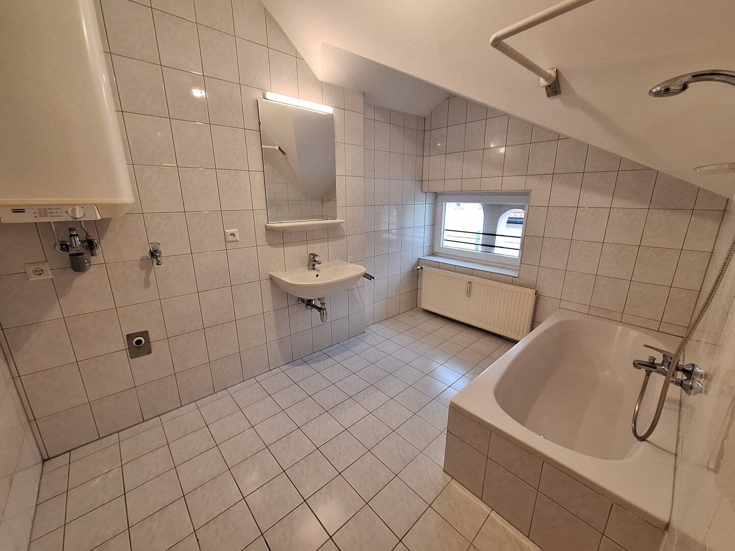 Attic apartment with balcony in central location