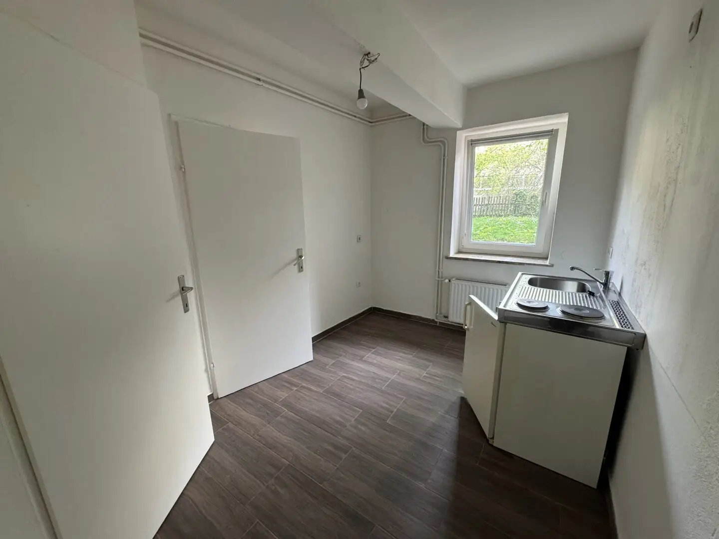 Quiet one room apartment on the ground floor with a view of the green inner courtyard