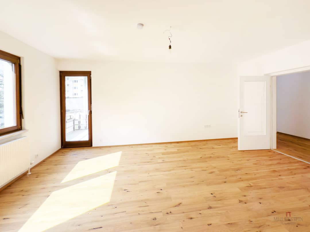 Erdgeschosswohnung mit Balkon und Gartenblick