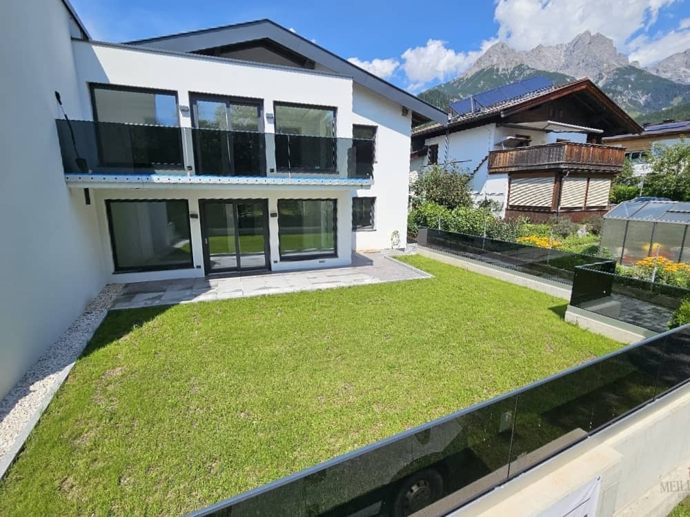 Newly built apartment with balcony and garden