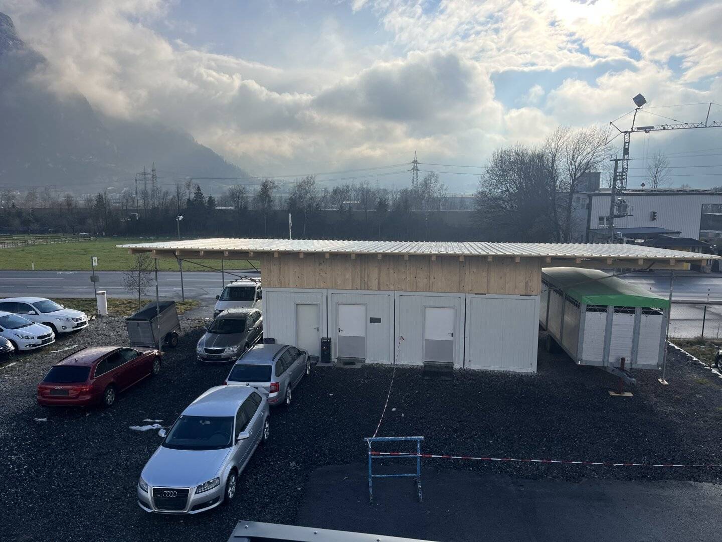 Storage space / car dealership, approx 460 m² to 700 m², partly covered outdoor area with 2 double containers and excellent highway access to Wiesing Autobahn on-ramp? No trailing punctuation? But we must provide text.