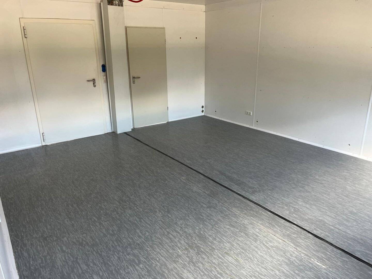 Storage space / car dealership, approx 460 m² to 700 m², partly covered outdoor area with 2 double containers and excellent highway access to Wiesing Autobahn on-ramp? No trailing punctuation? But we must provide text.