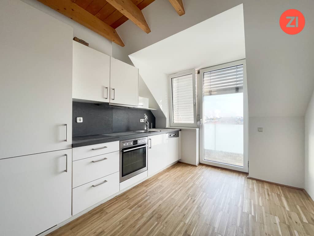 Attic apartment with modern kitchen and balcony