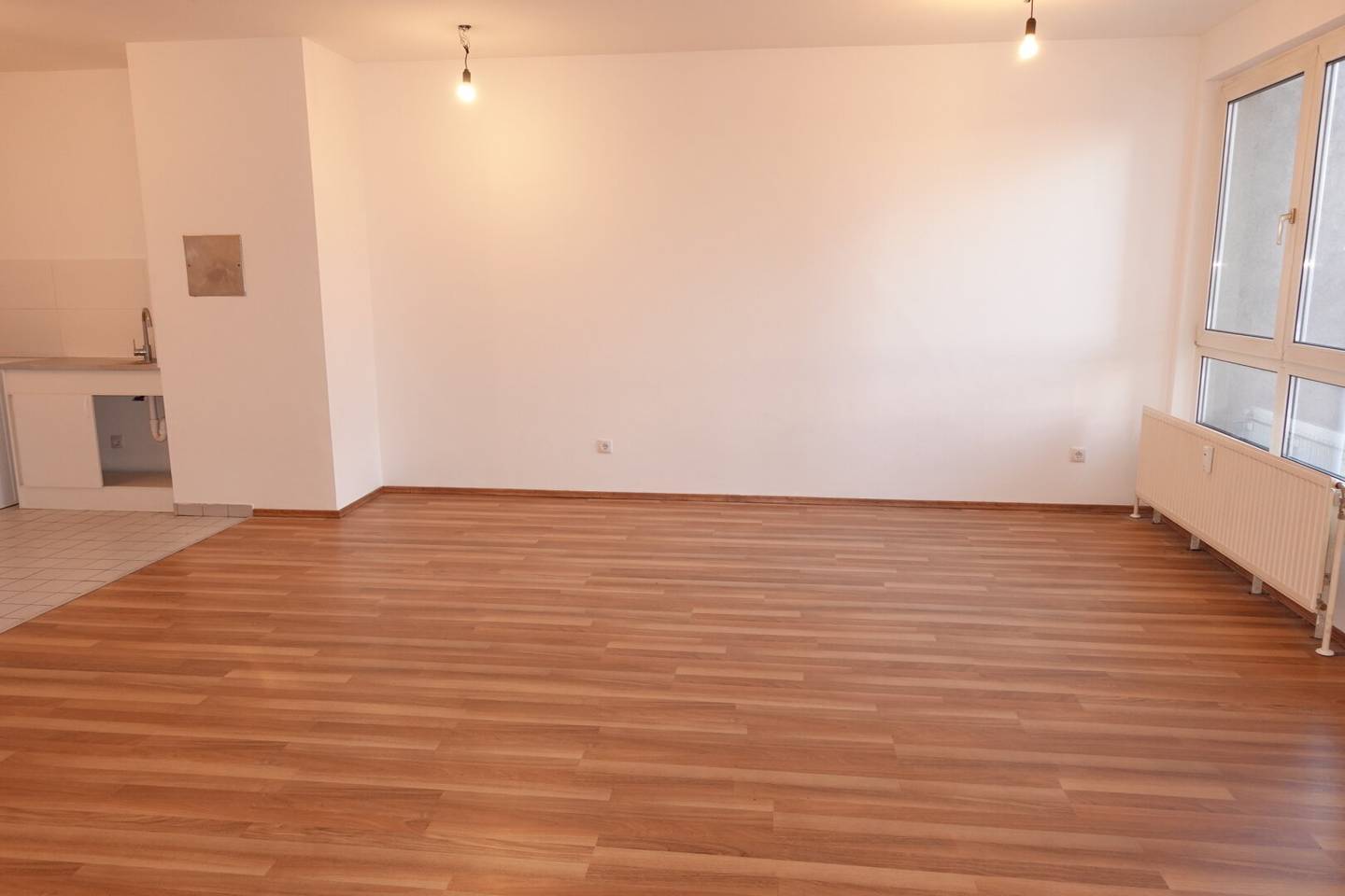 Neubauwohnung mit Wohnküche und Gartenblick