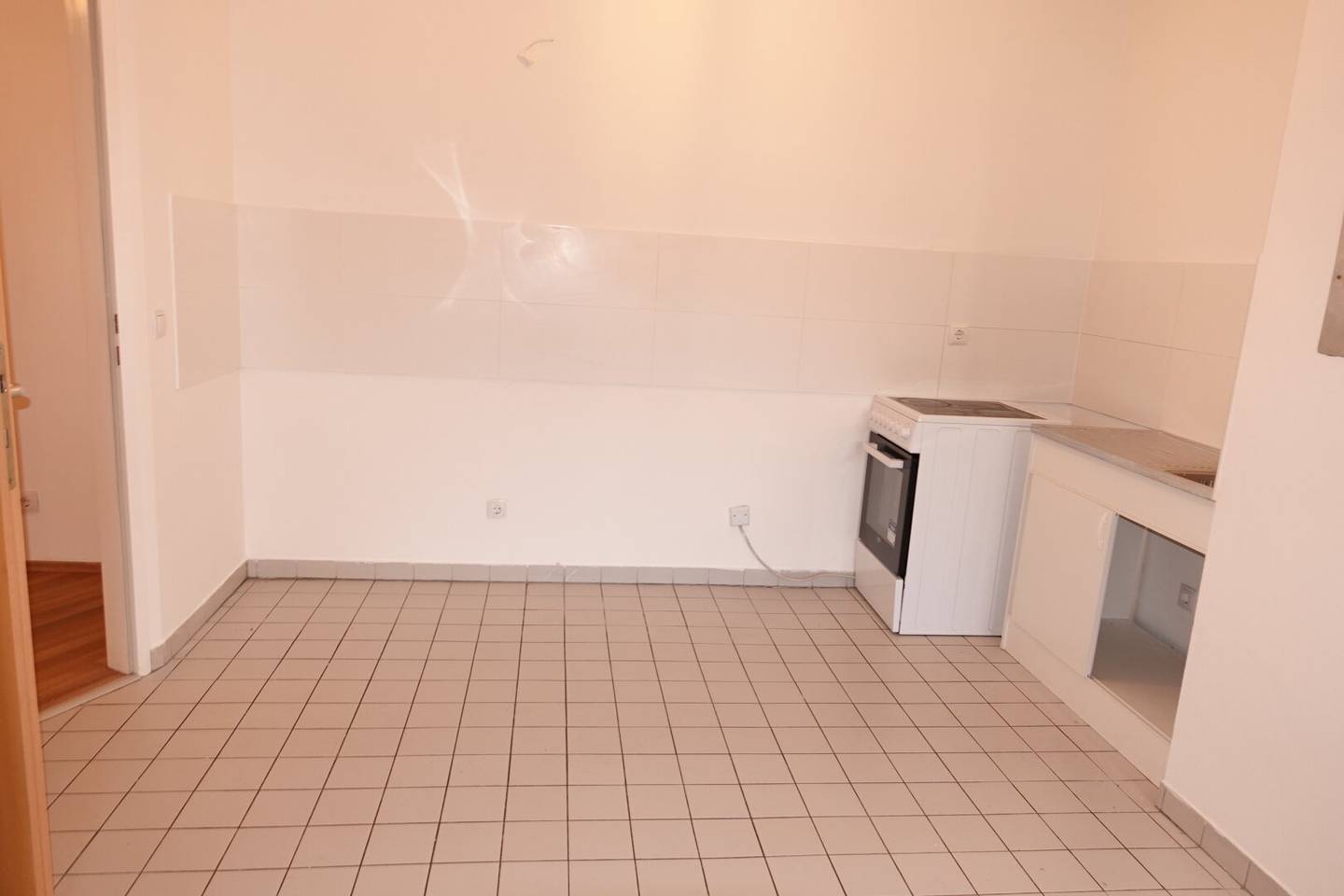Neubauwohnung mit Wohnküche und Gartenblick