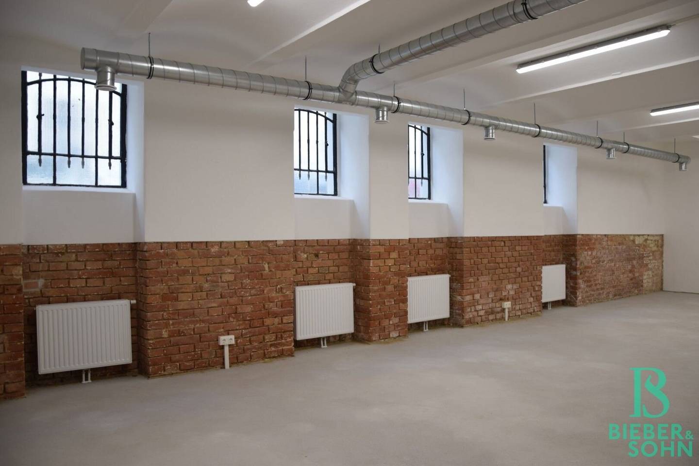 Representative, completely renovated basement loft, high-quality storage spaces