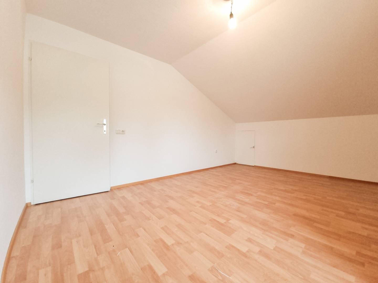 Top floor apartment with open plan kitchen