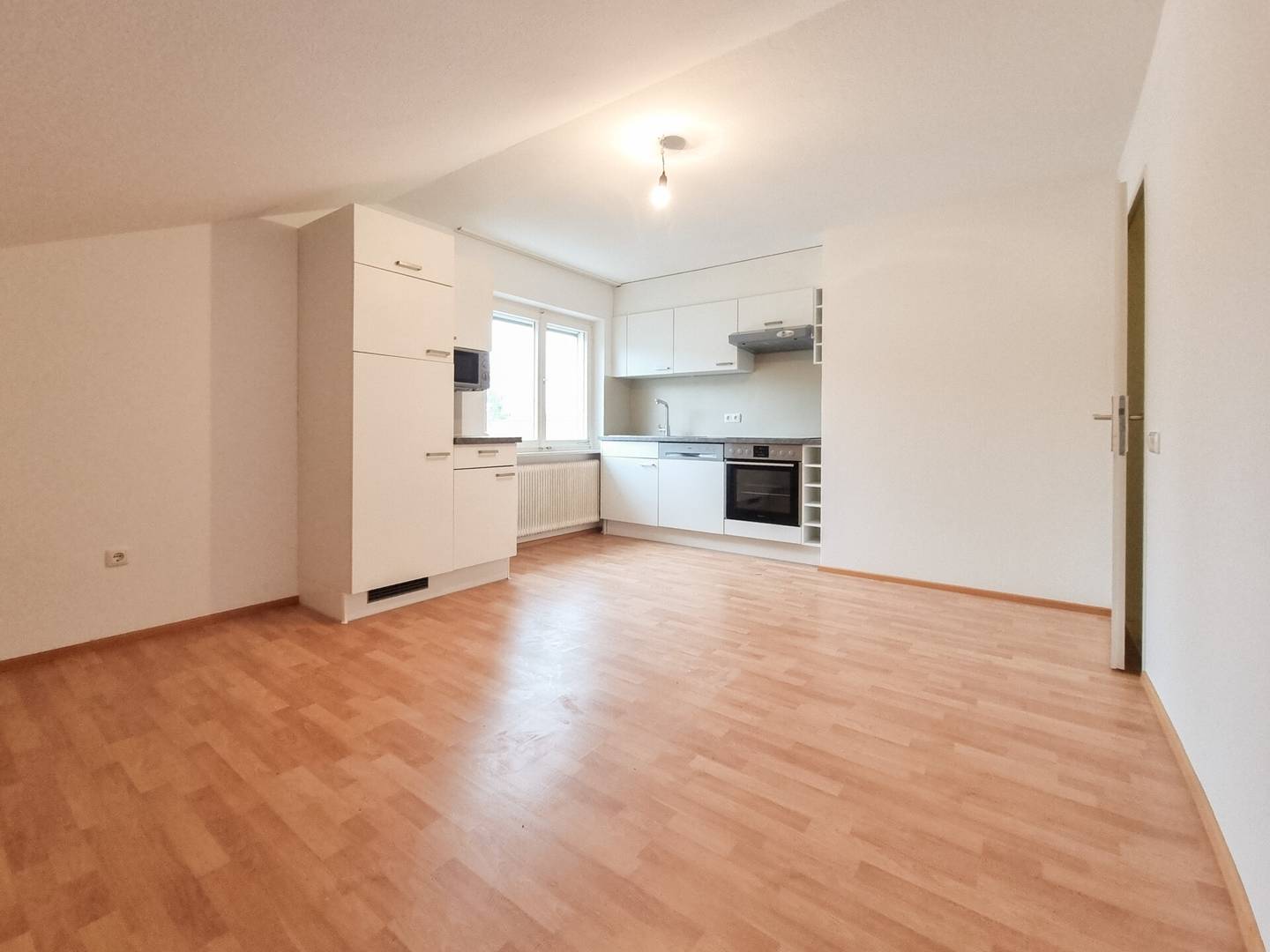 Top floor apartment with open plan kitchen