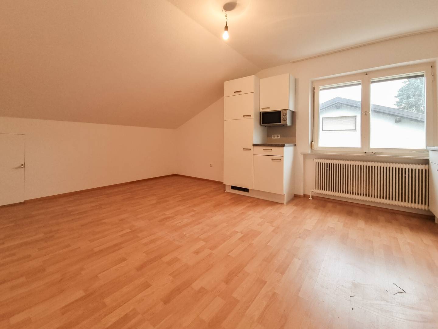 Top floor apartment with open plan kitchen
