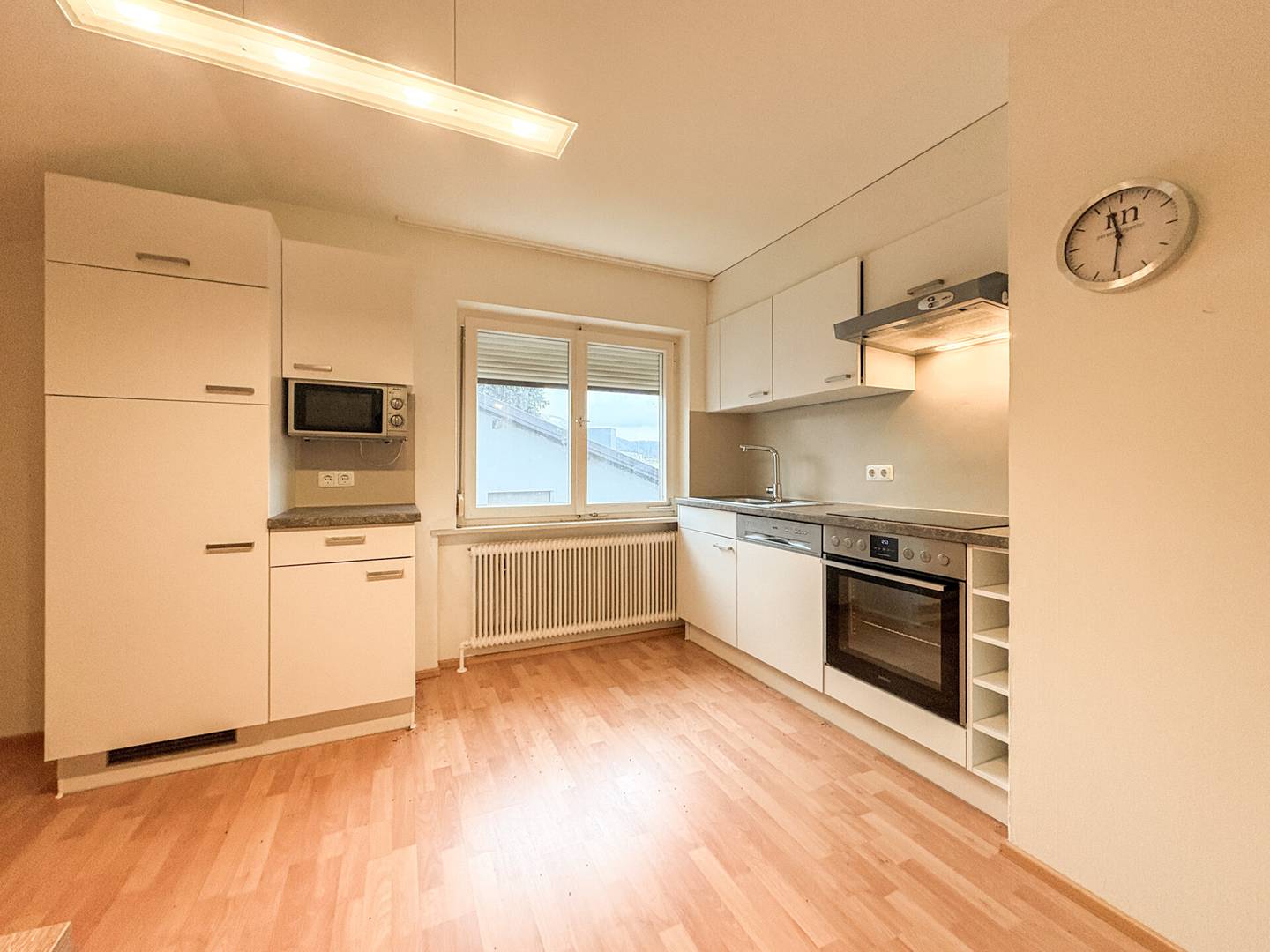 Top floor apartment with open plan kitchen