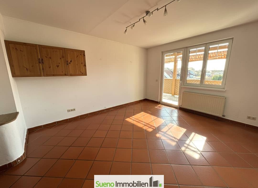 Wohnung im Dachgeschoss mit Balkon und Tiefgarage