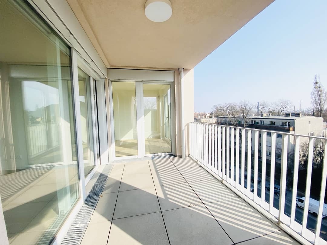 Apartment with open plan living area and balcony