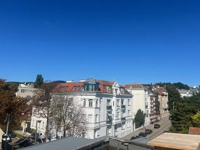 Attic floor apartment with roof terraces and bright living kitchen