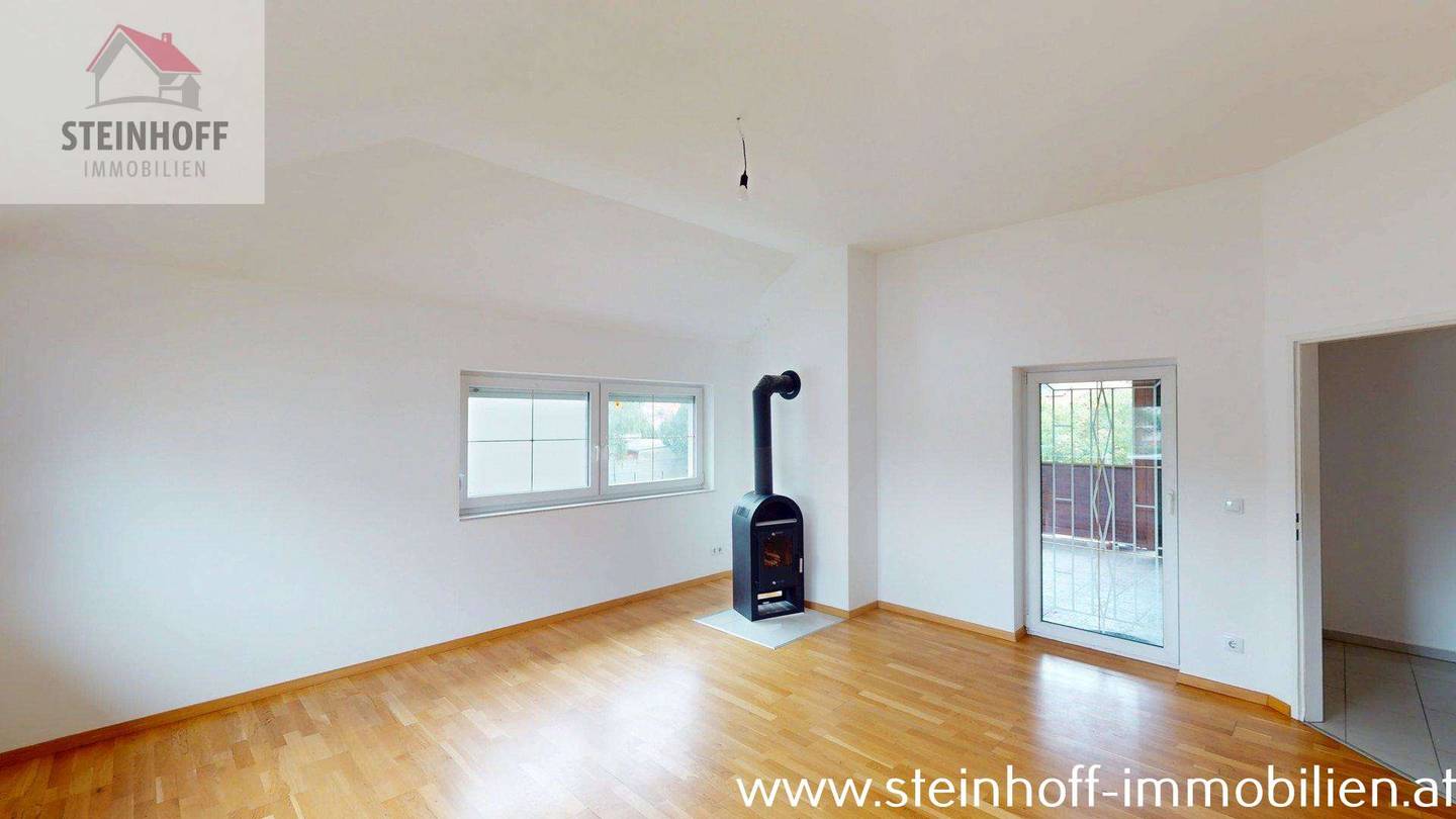 Spacious attic apartment with a loggia and wood burning stove