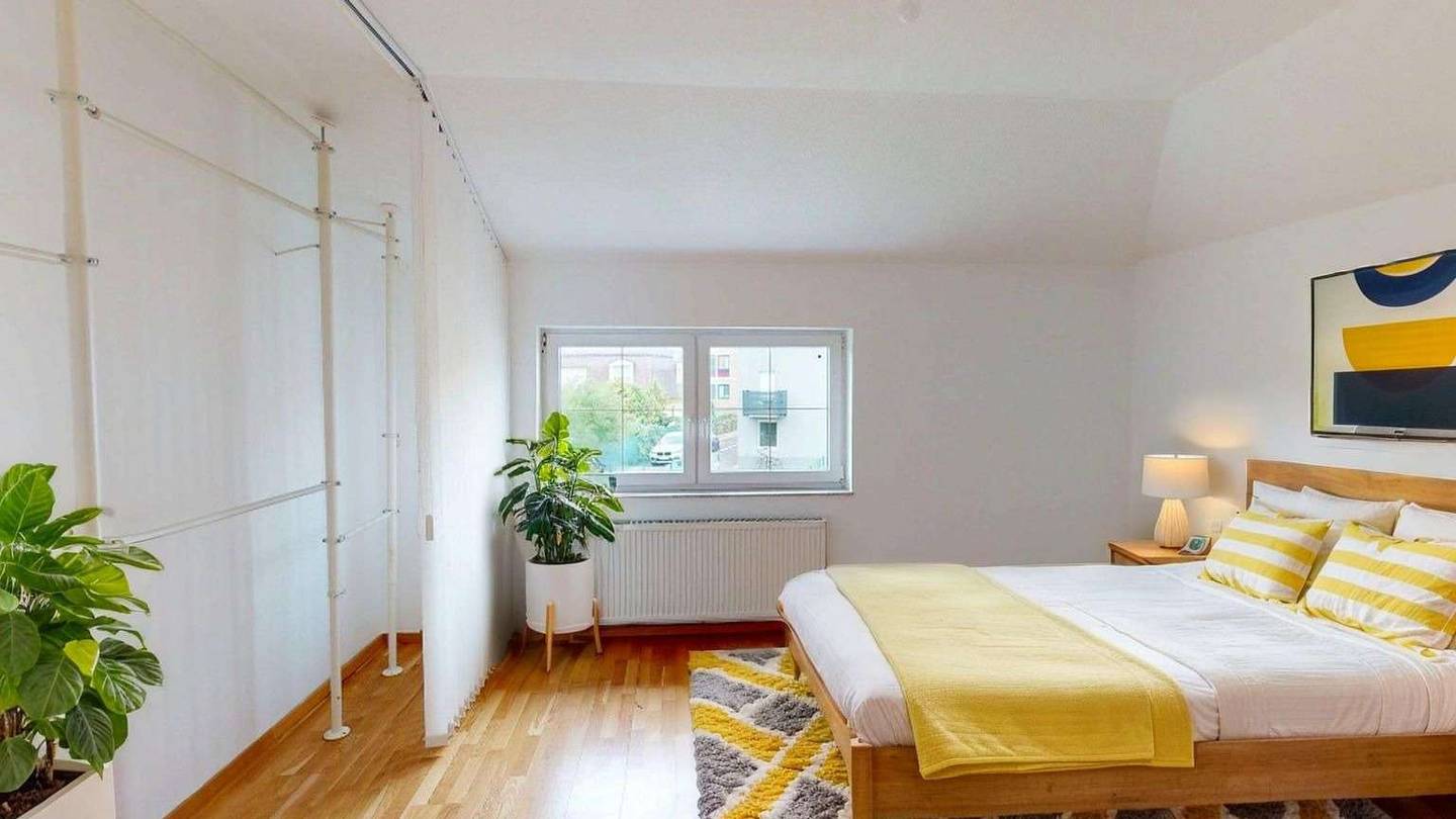 Spacious attic apartment with a loggia and wood burning stove