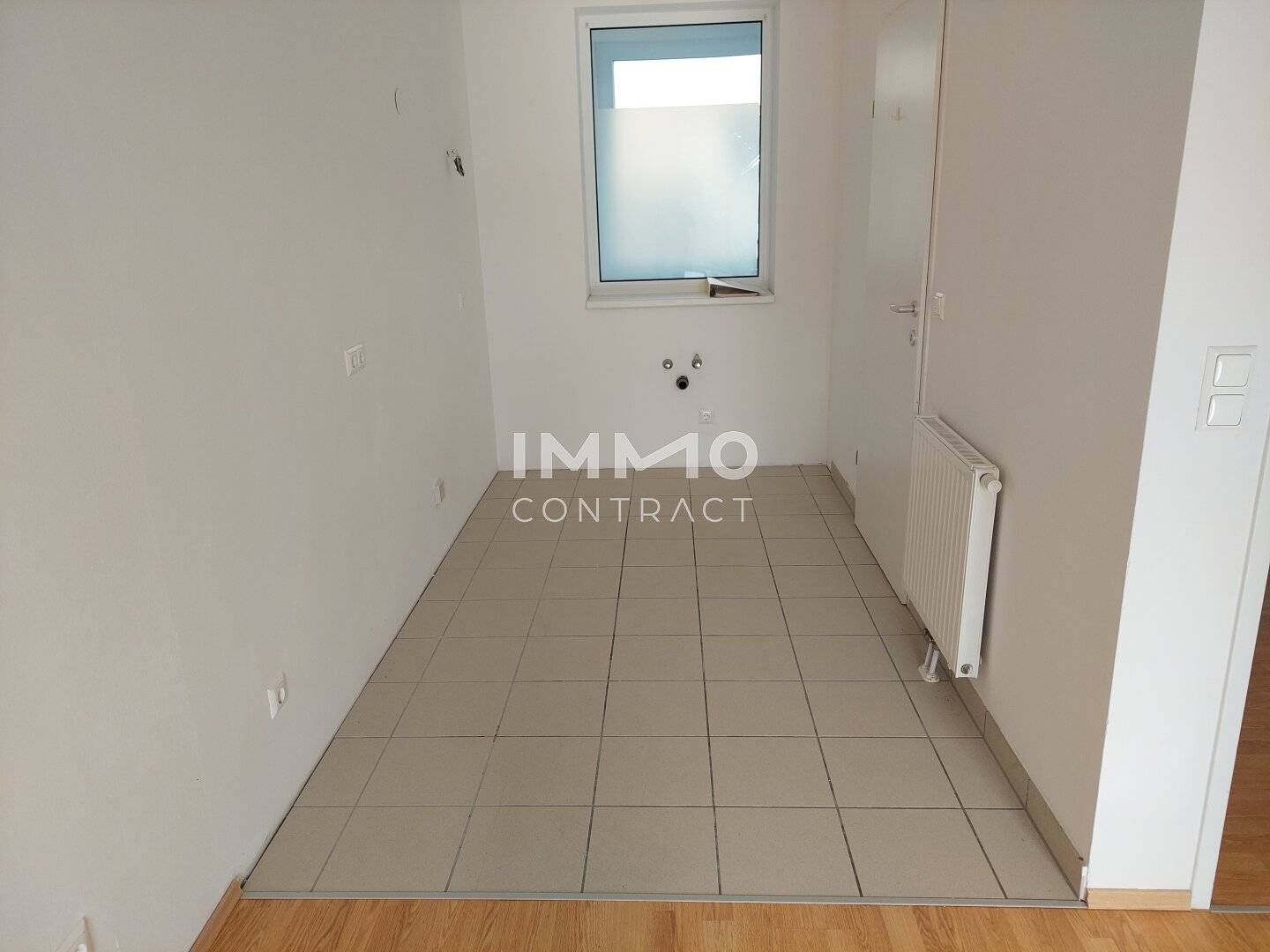 Bright top floor apartment with balcony and lift including underground parking