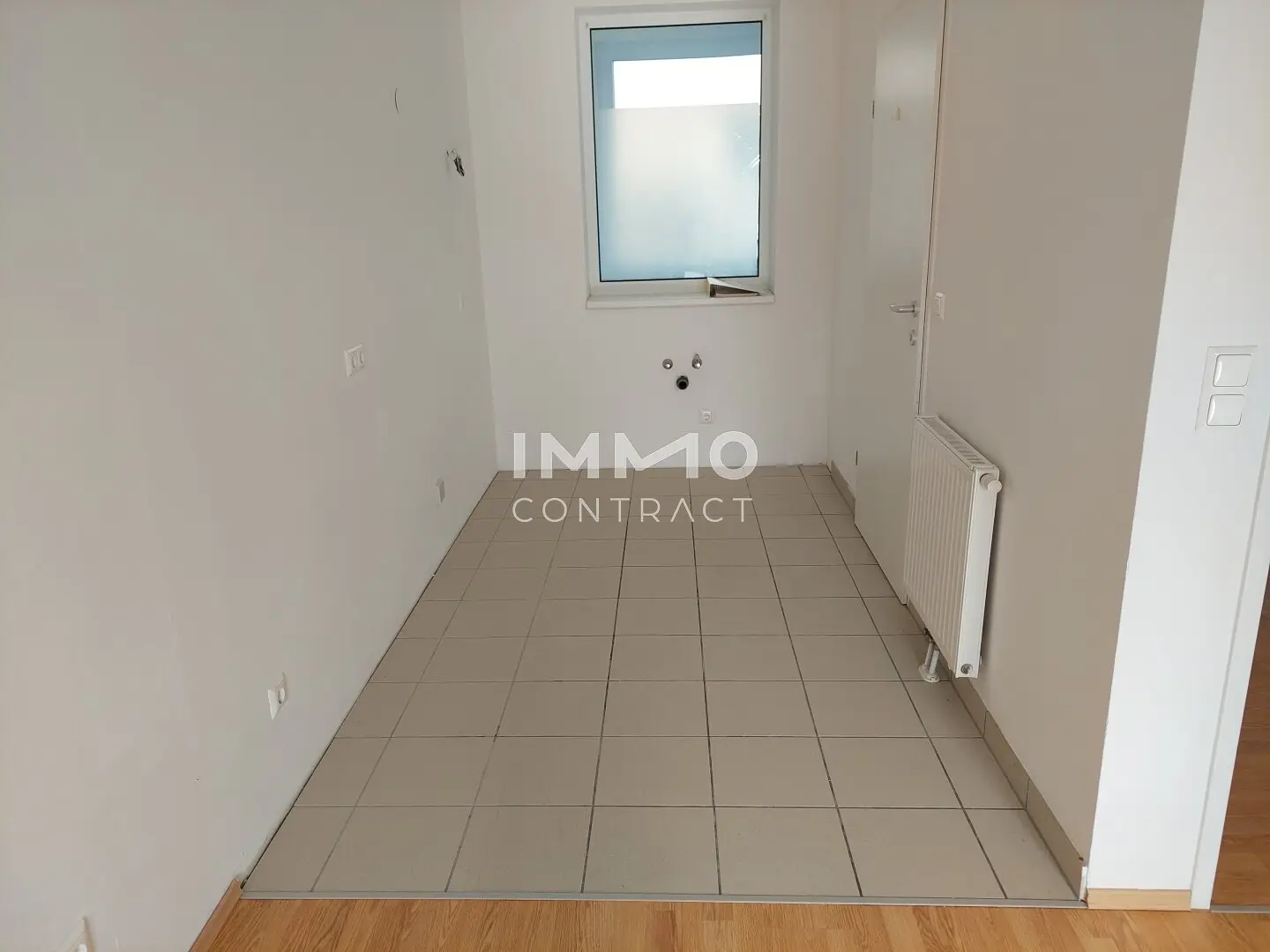 Bright top floor apartment with balcony and lift including underground parking