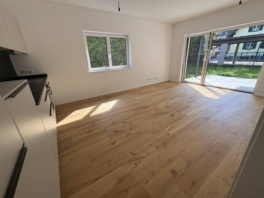 Wohnung Erstbezug mit Eigengarten im Zentrum
