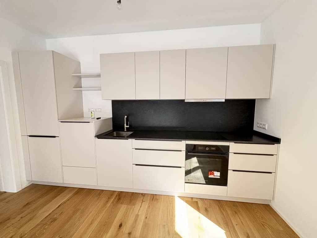 Wohnung Erstbezug mit Eigengarten im Zentrum