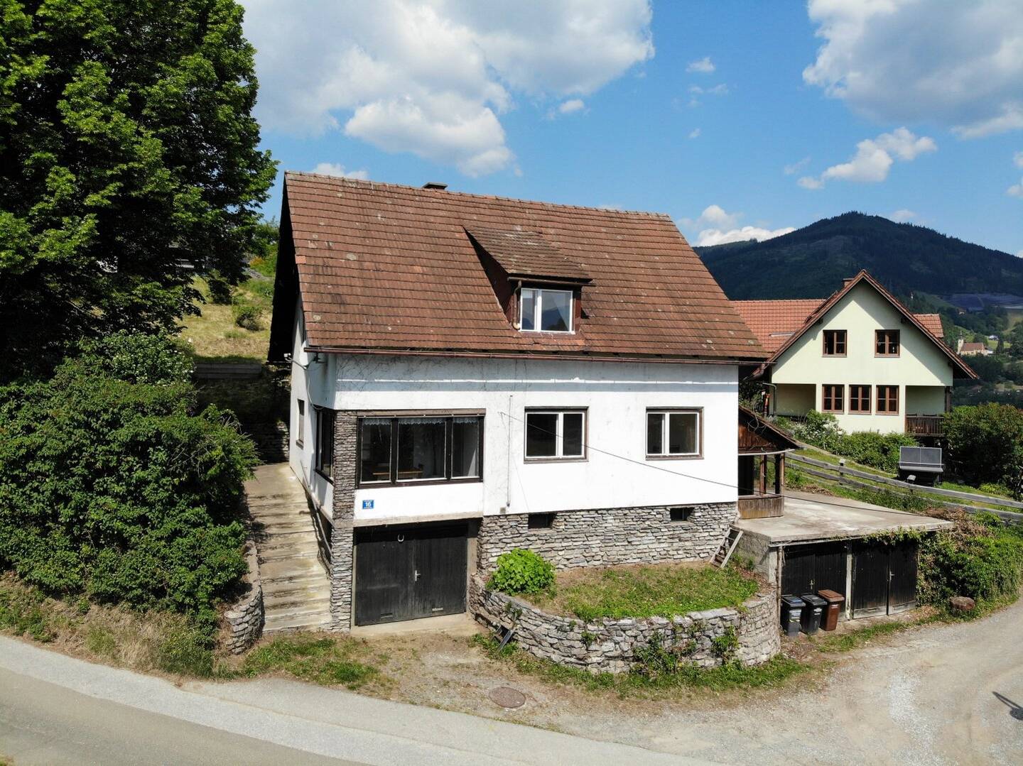 Renovation-Ready House with Garages in Bruck