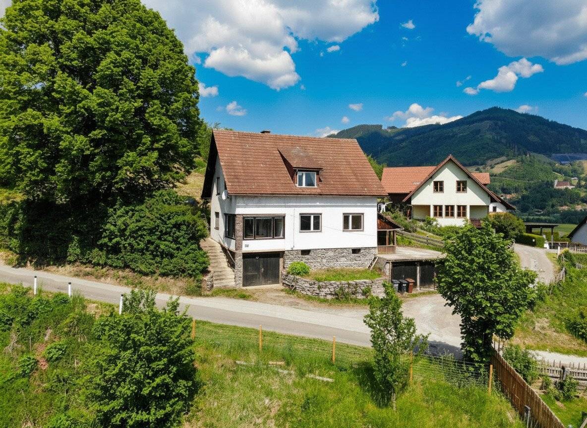 Renovation-Ready House with Garages in Bruck