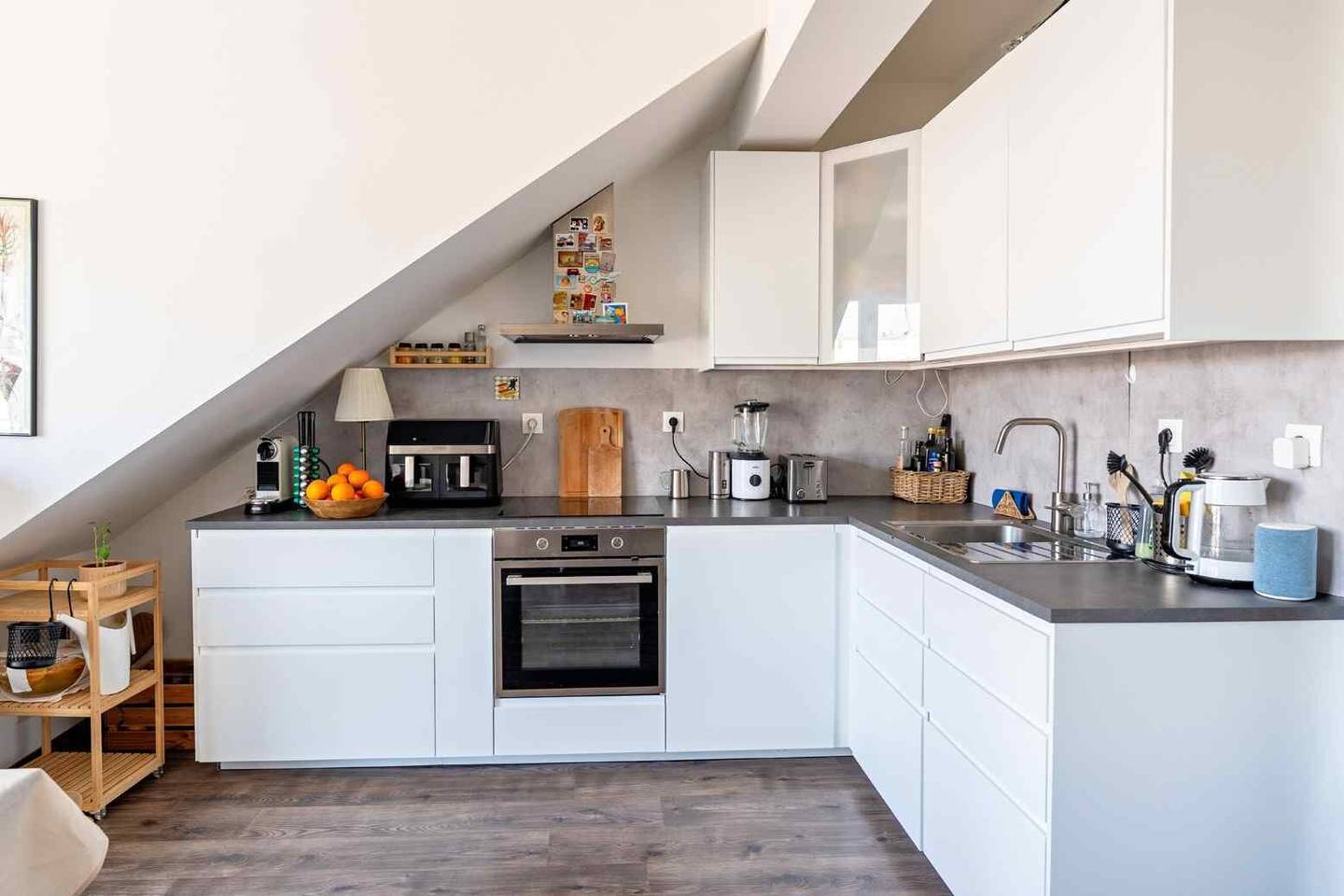 Attic apartment with spacious balcony and renovated bathroom