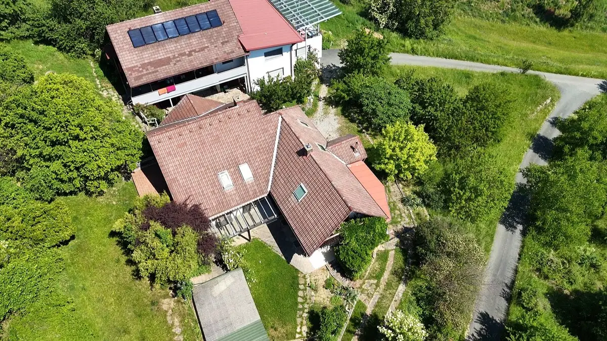 Multi family house with terraces and garage in sunny hillside location