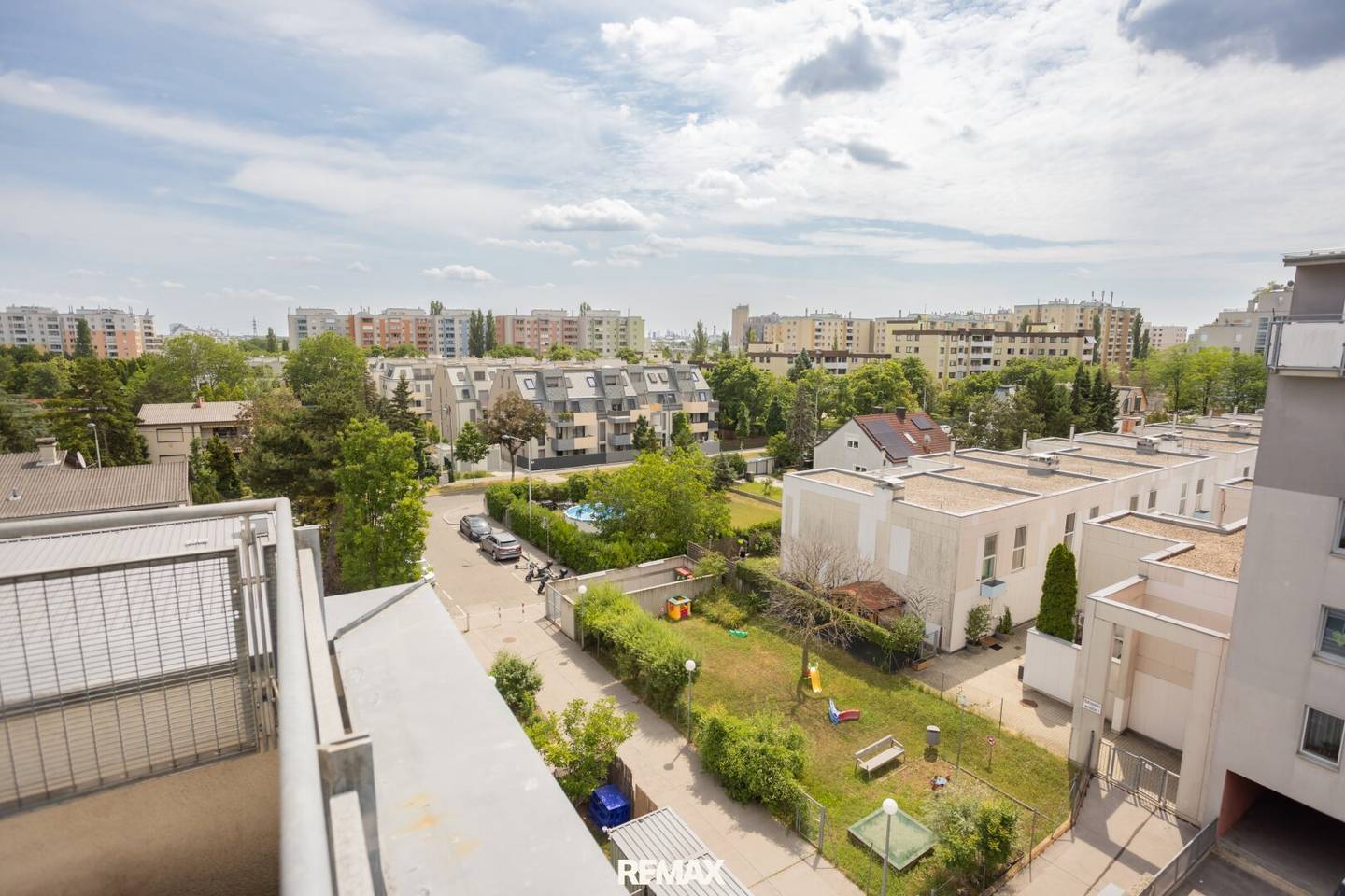 Maisonette apartment with balcony and round window on two levels