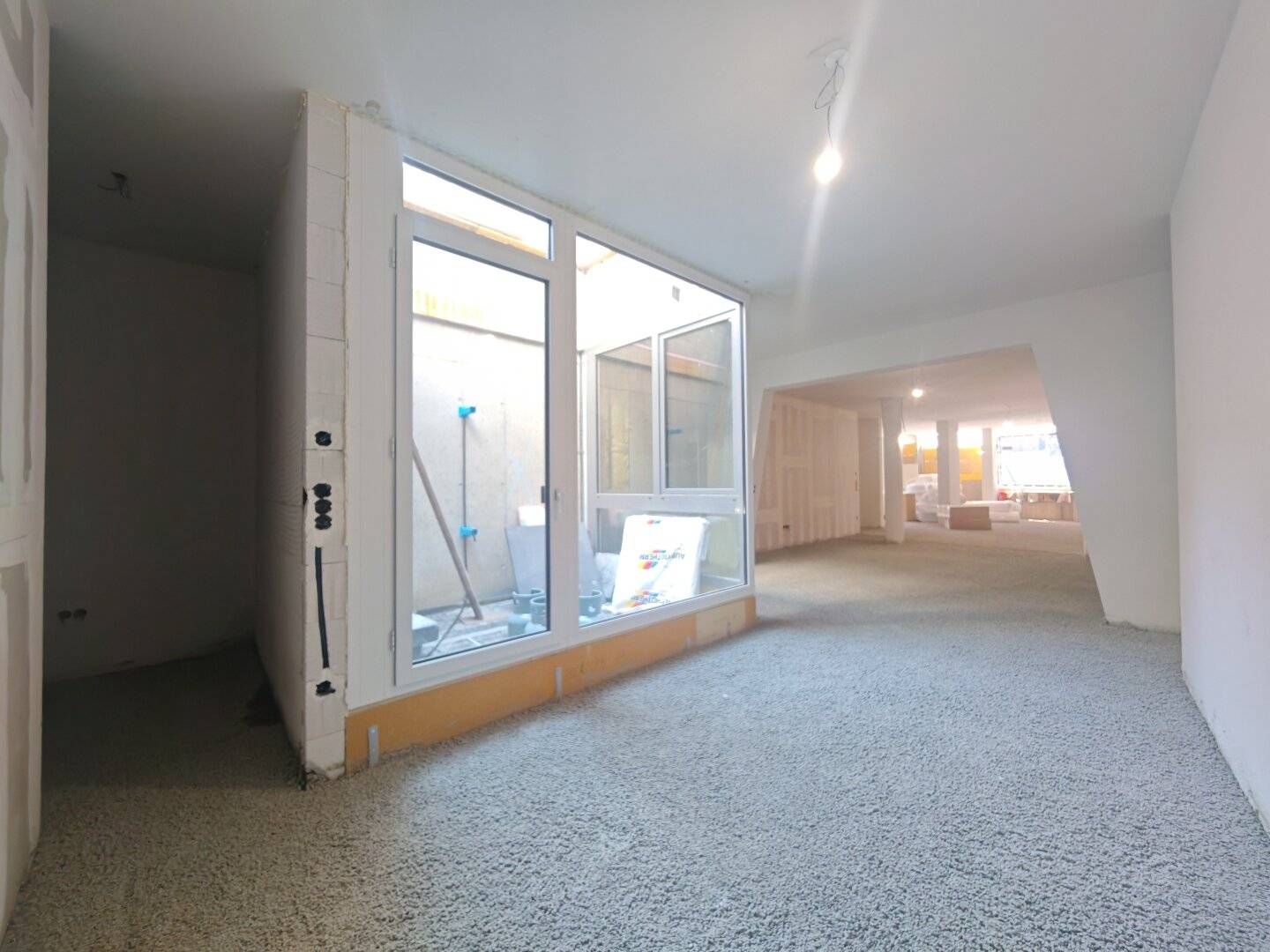 Retail space with display window and atrium at Baumgartner-Casino Park