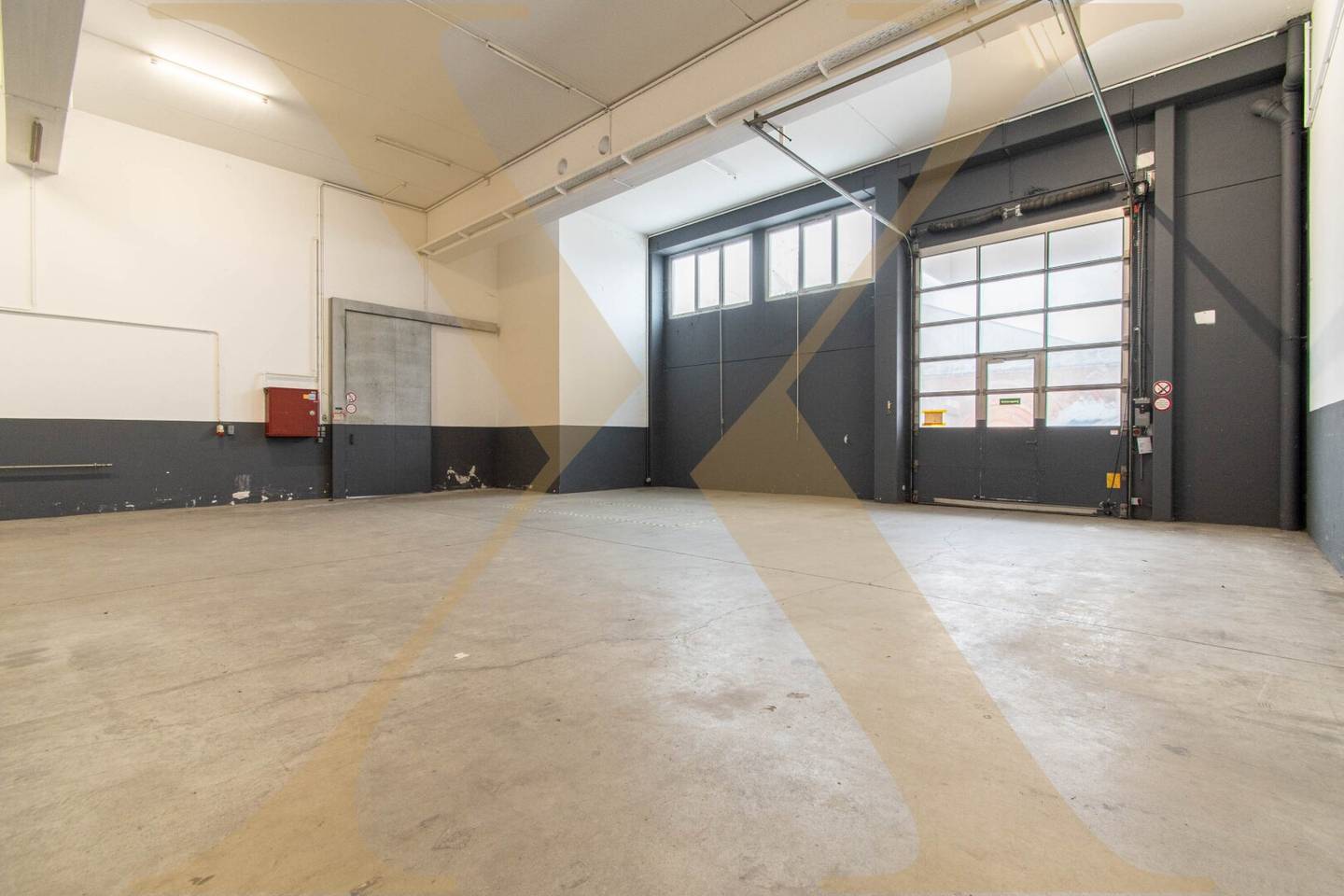 Commercial property with storage halls roller doors and rooftop terrace