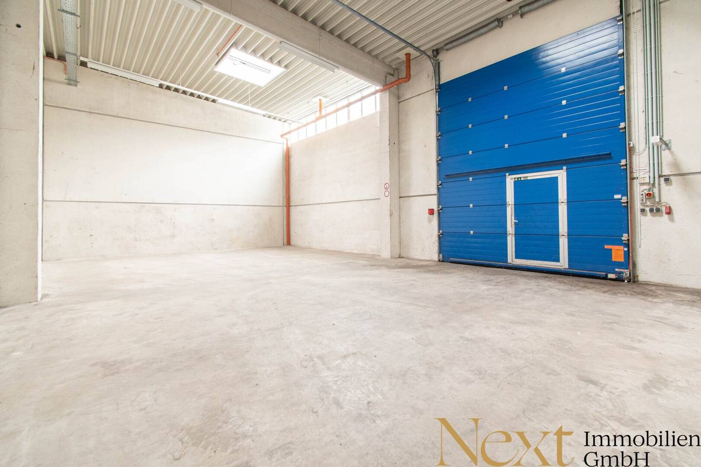 Commercial property with warehouses roller doors and rooftop terrace near station