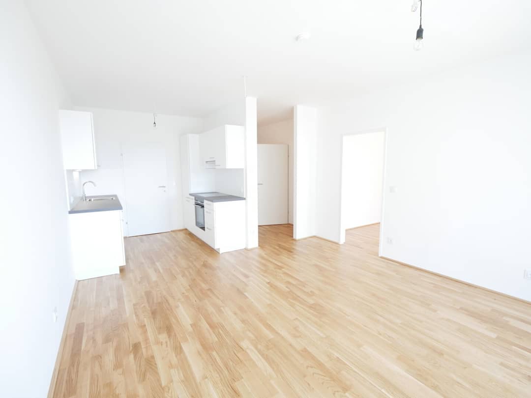 Helle Neubauwohnung mit Balkon und Einbauküche in Grünlage