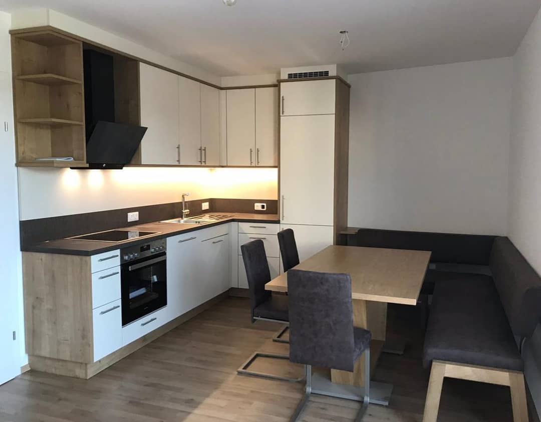 Bright new build apartment with balconies and underground parking in central location