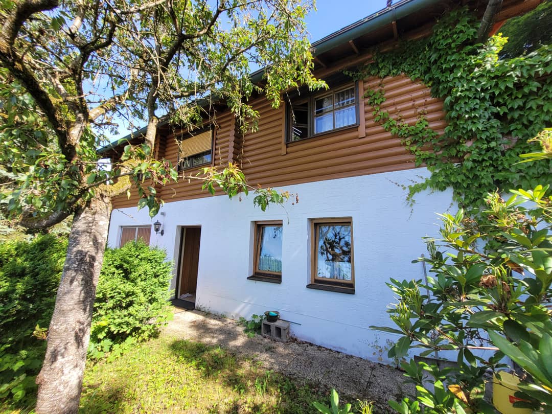 Quiet log cabin with sauna house and tiled stove at the forest edge