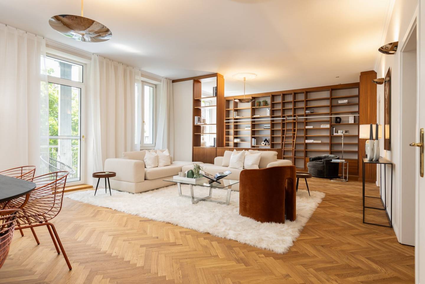 Timeless historic apartment elegance with open fireplace, custom built-ins and balcony overlooking greenery