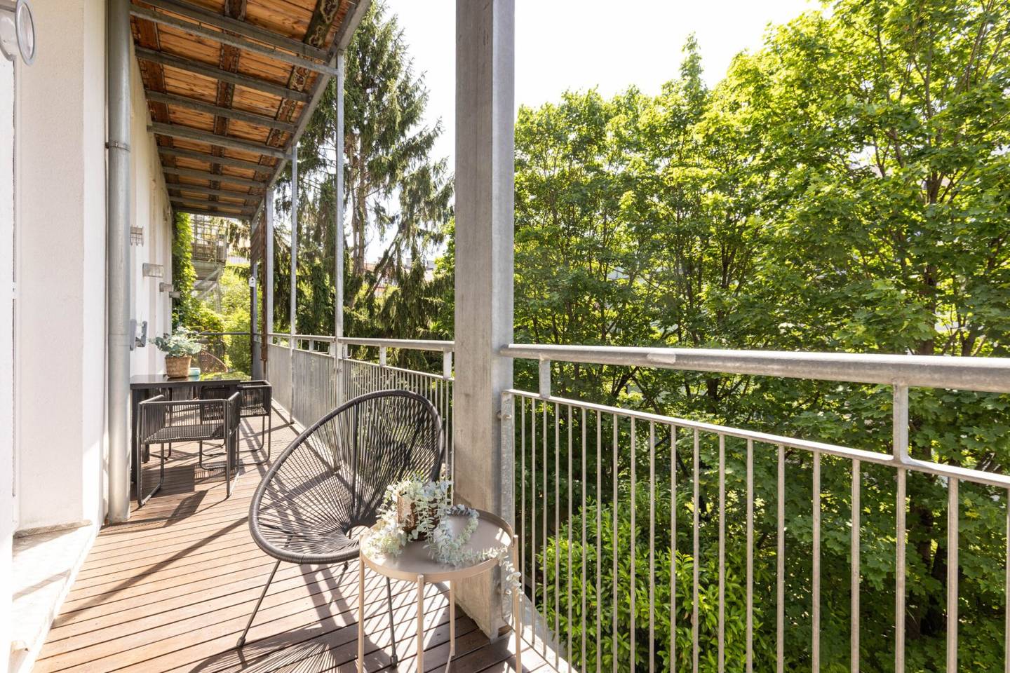 Timeless historic apartment elegance with open fireplace, custom built-ins and balcony overlooking greenery