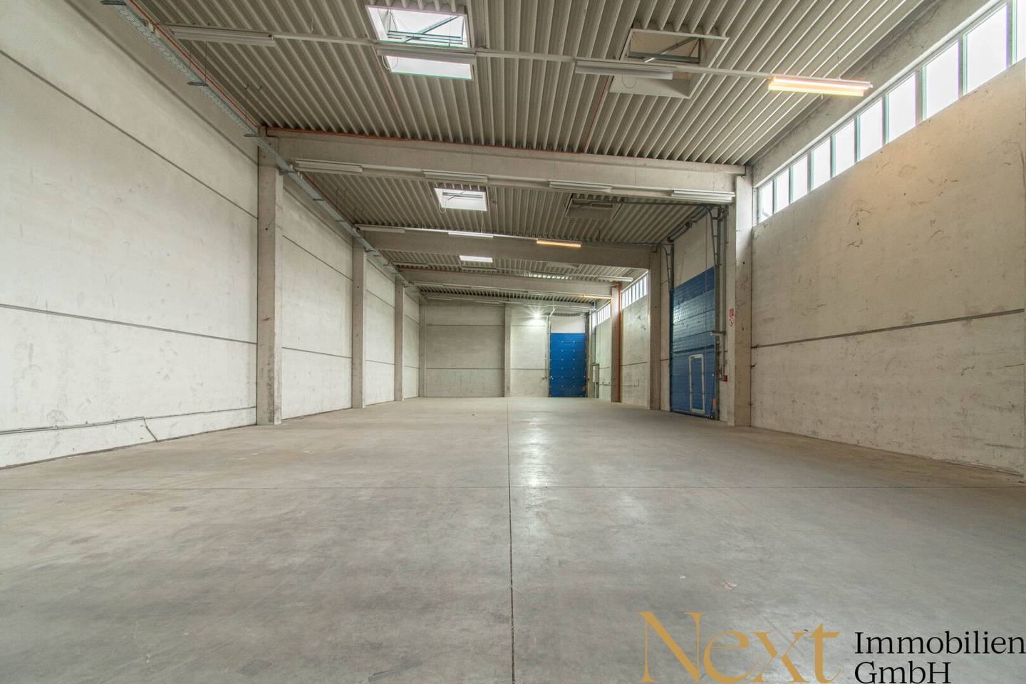Commercial property with warehouse halls and roller doors in central location
