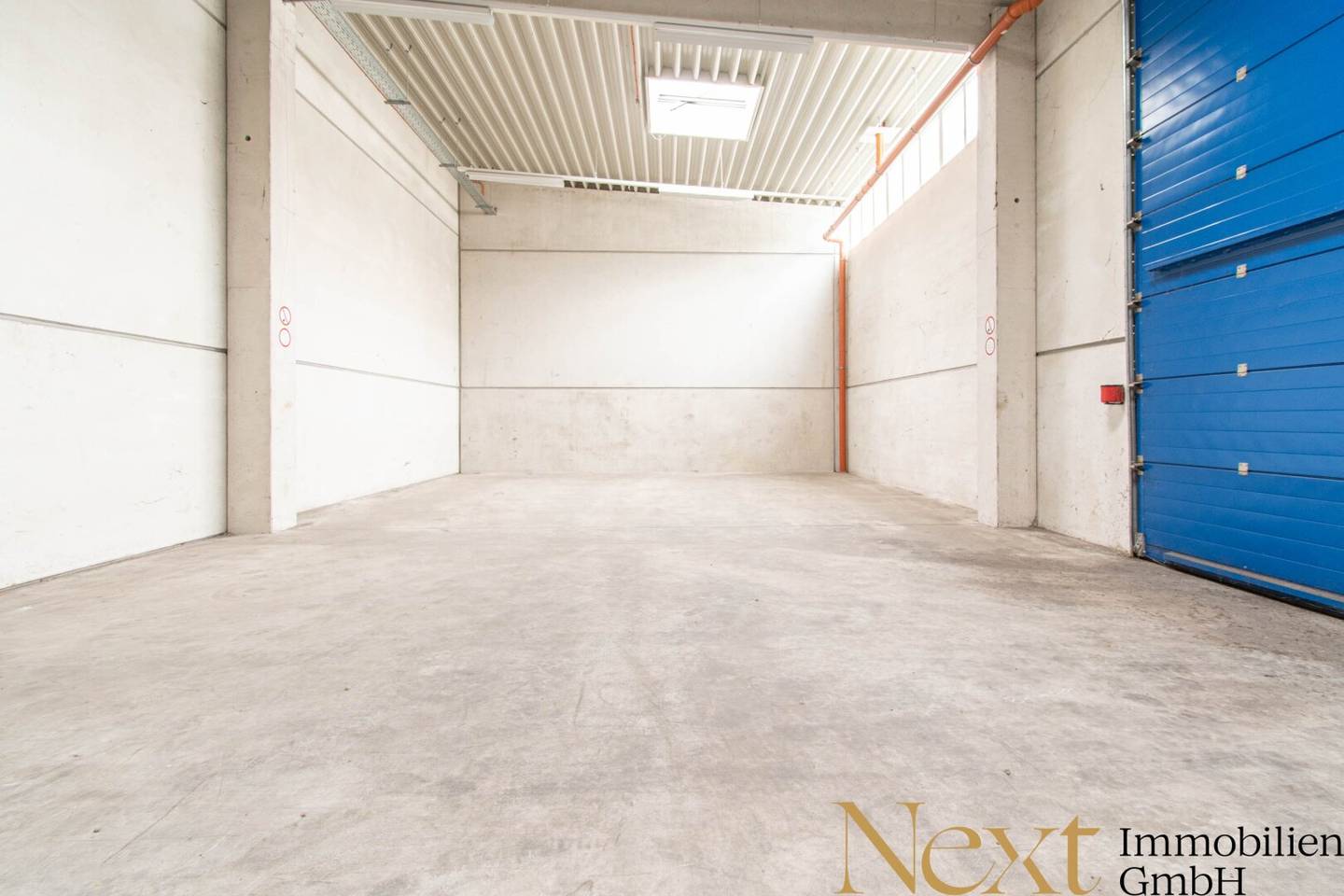 Commercial property with warehouse halls and roller doors in central location