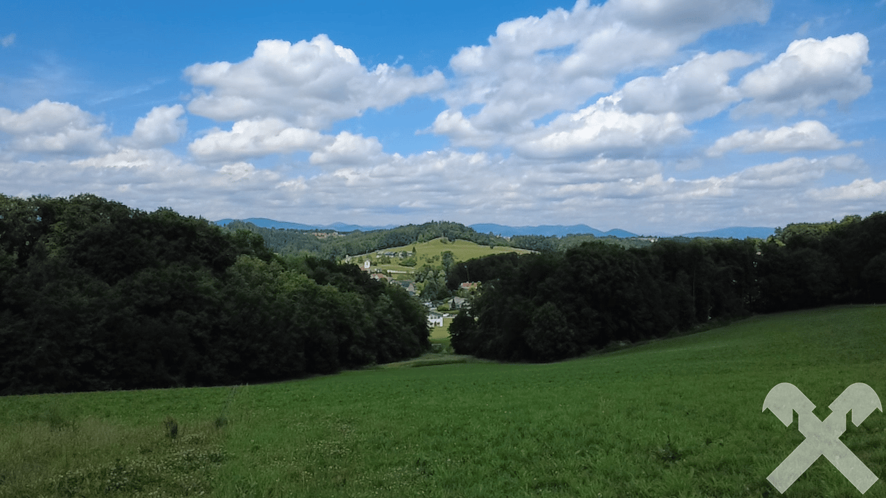 Spacious agricultural land with woodland sections