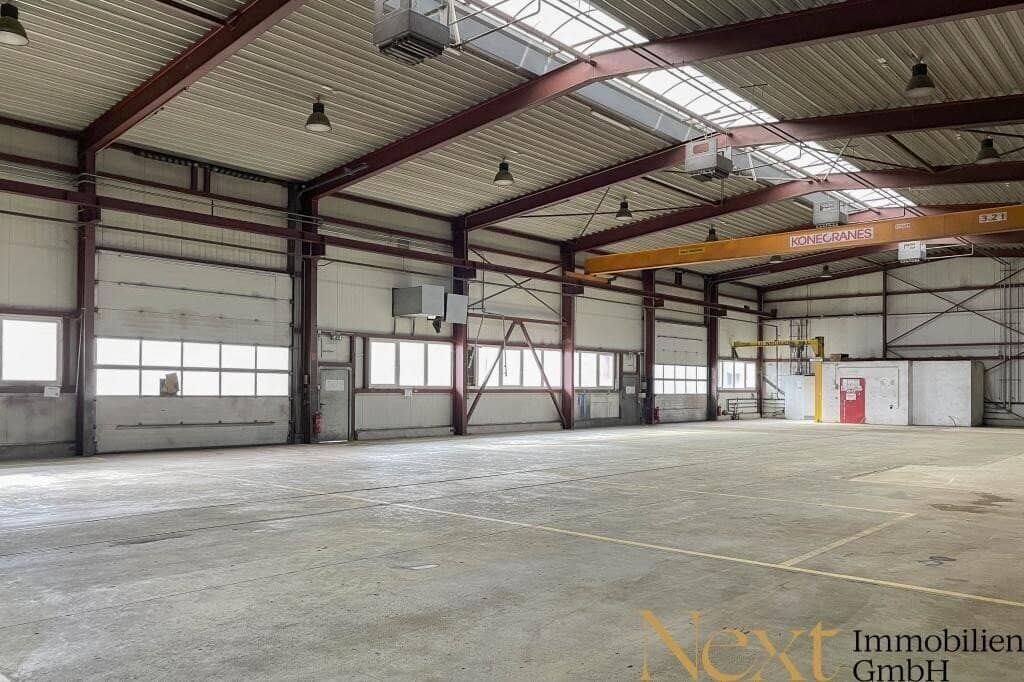 Heated warehouse with approx. 7 to 9 meter hall height, various crane installations, open spaces, etc. in Asten