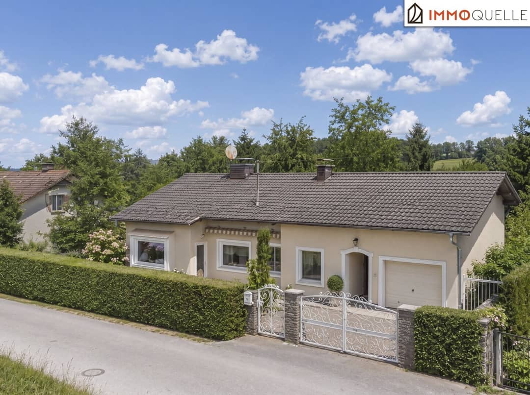 Family house with garden balcony and garage in private setting