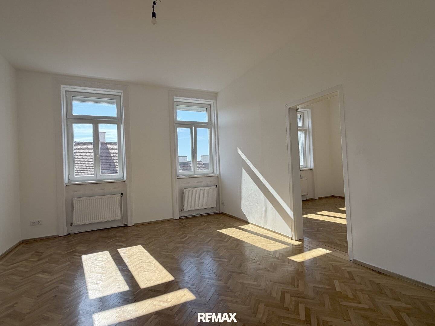 Bright period apartment with tiled stove and herringbone parquet