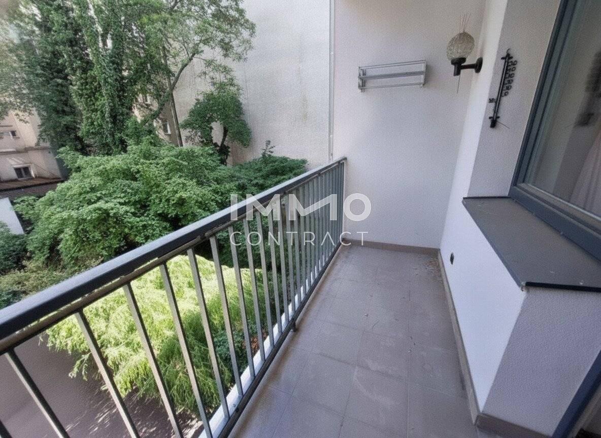 Charming living with marble fireplace and courtyard loggia