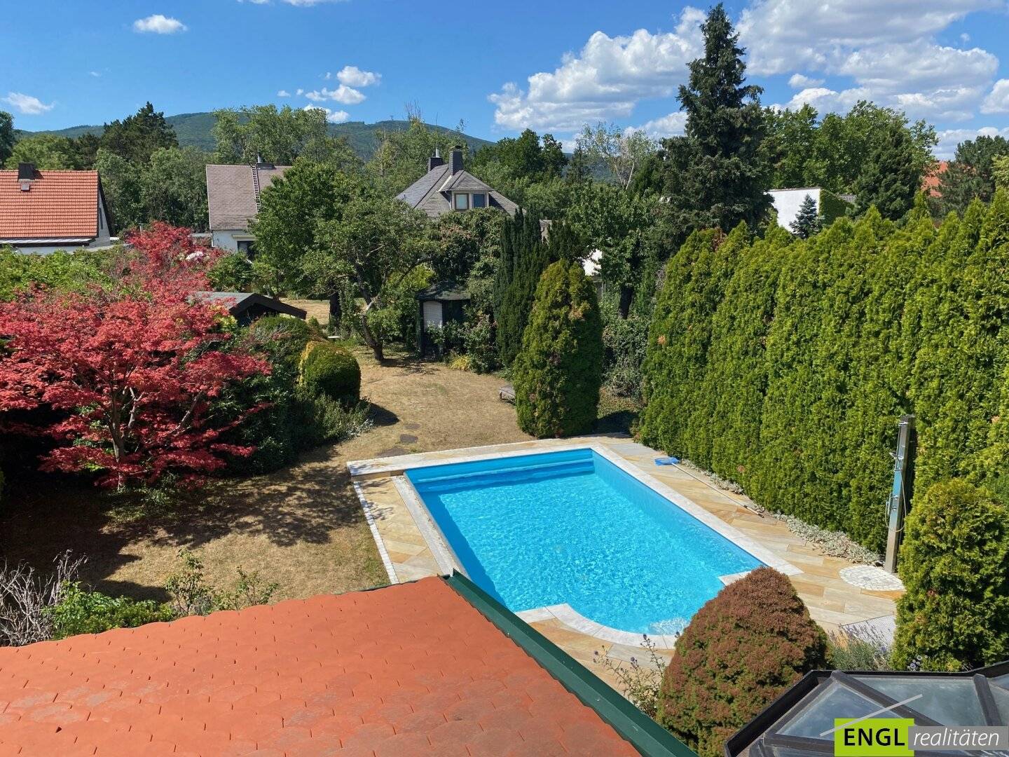 Family house with heated pool winter garden and carport