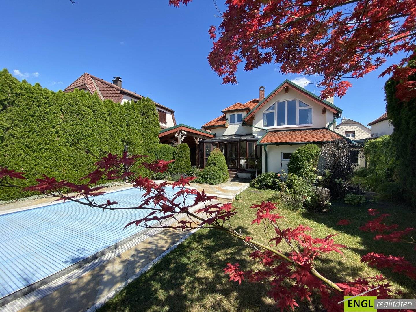 Family house with heated pool winter garden and carport