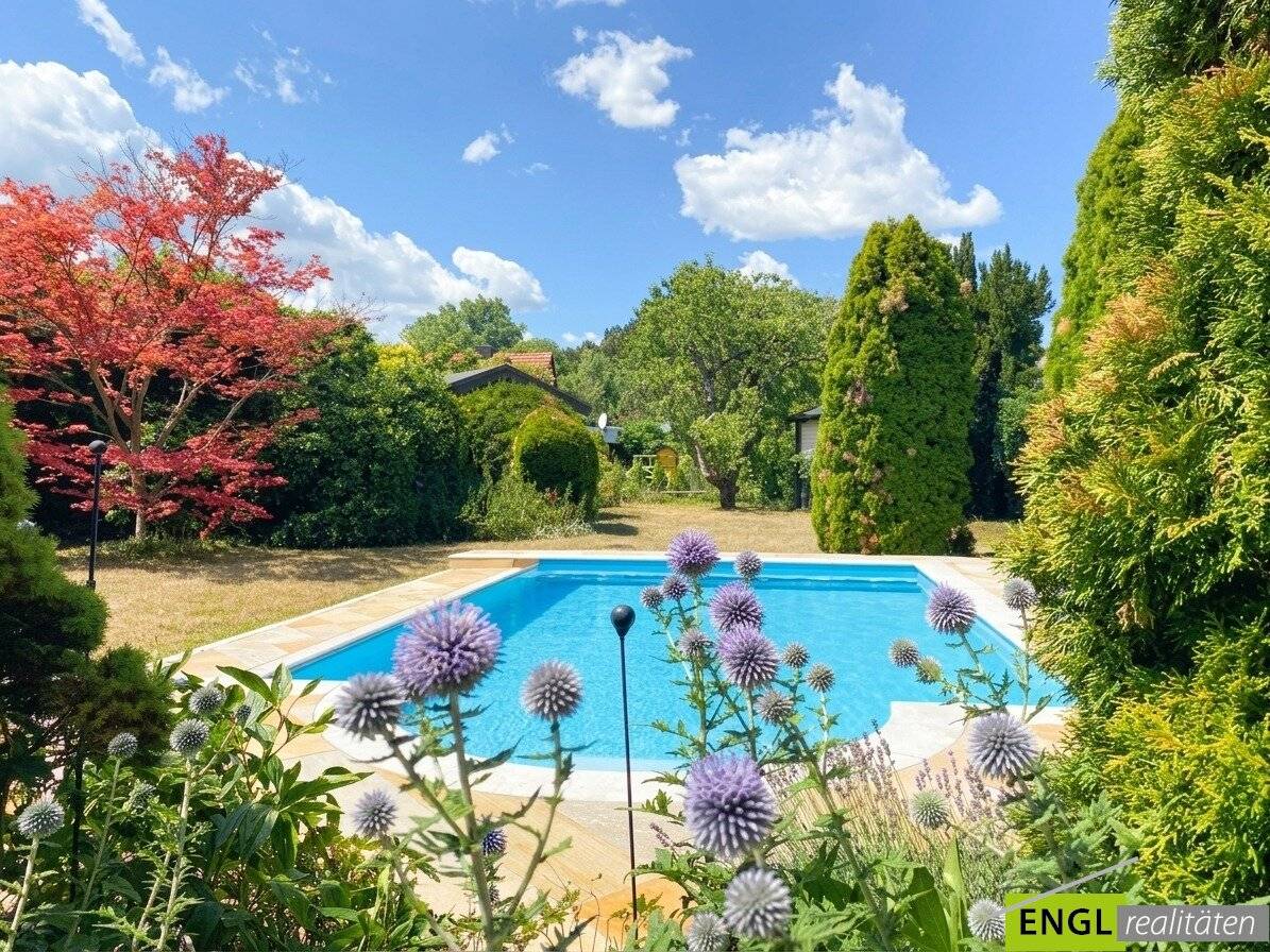Family house with heated pool winter garden and carport
