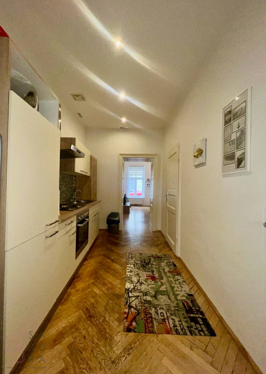 Charming Ground Floor with Parquet and Tiles in Historic Building