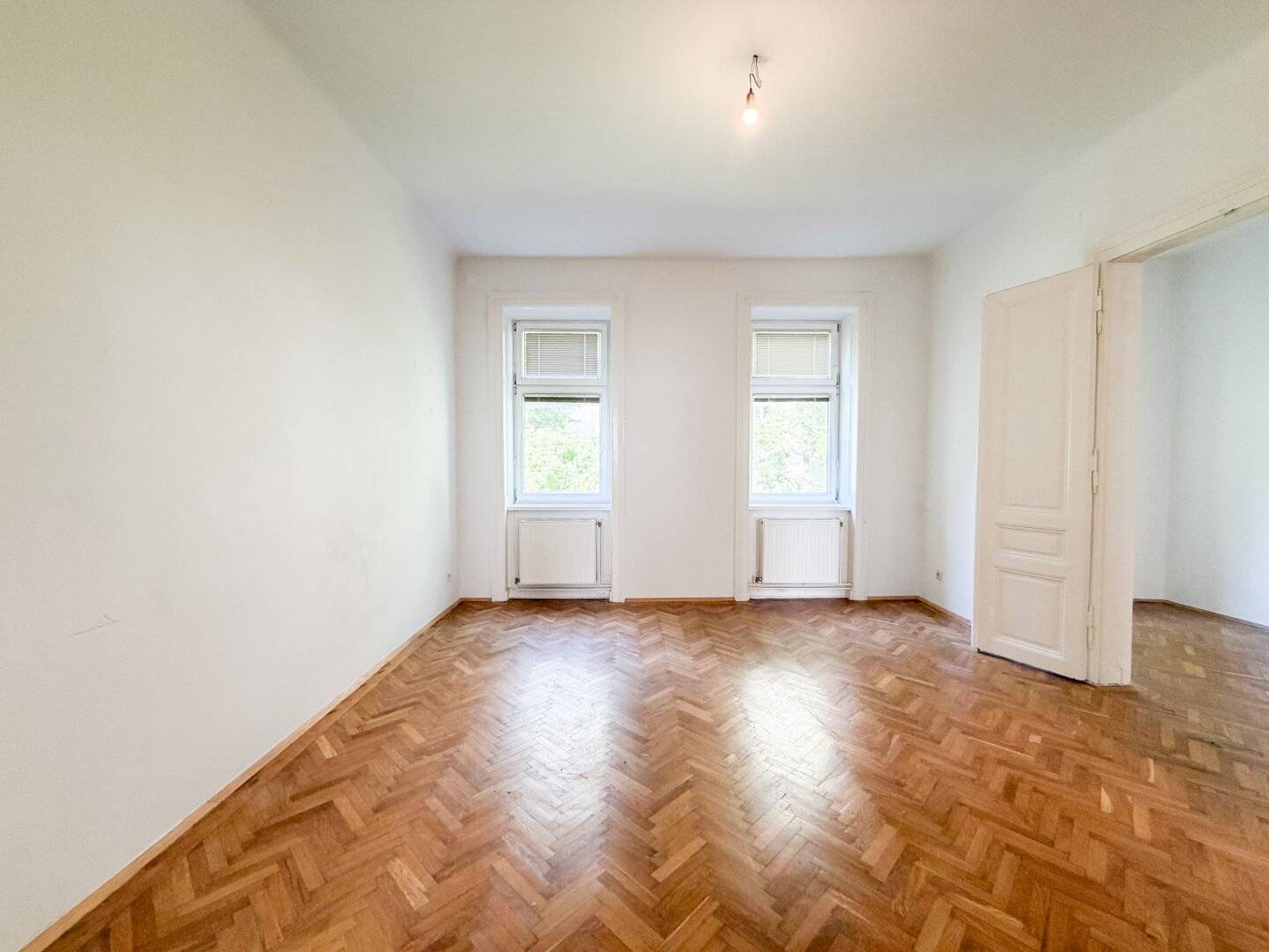 Altbau apartment with planned balcony and herringbone parquet in Währing