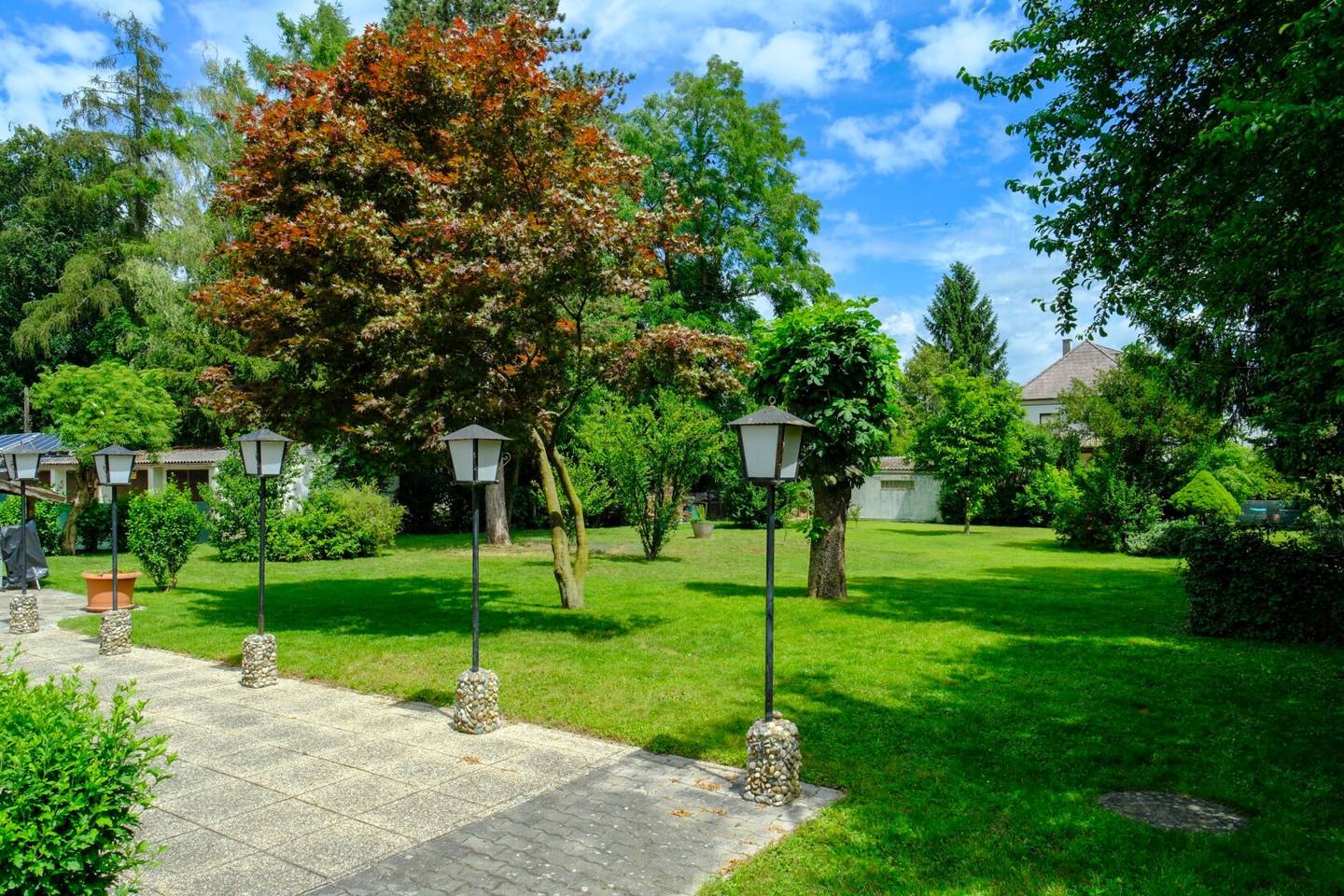 Apartment building with large garden in established urban location
