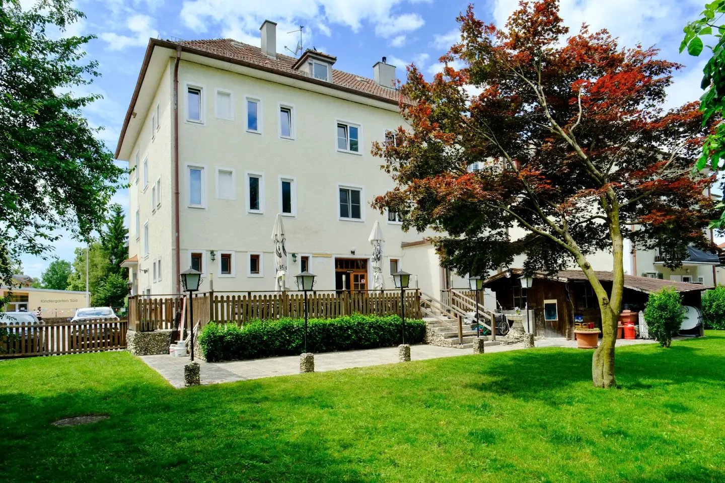 Apartment building with large garden in established urban location